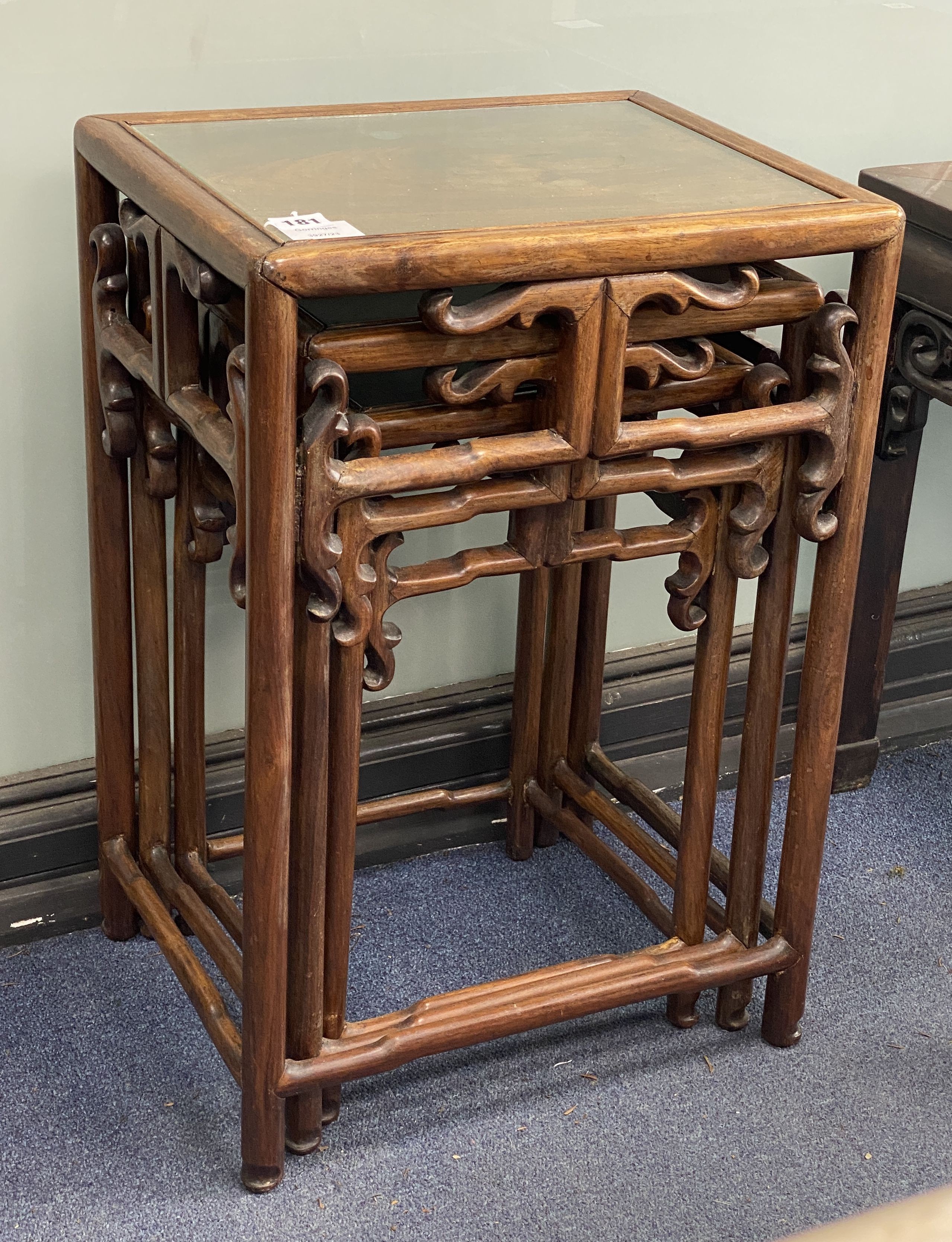 A nest of three Chinese hardwood tables, width 40cm, depth 32cm, height 59cm